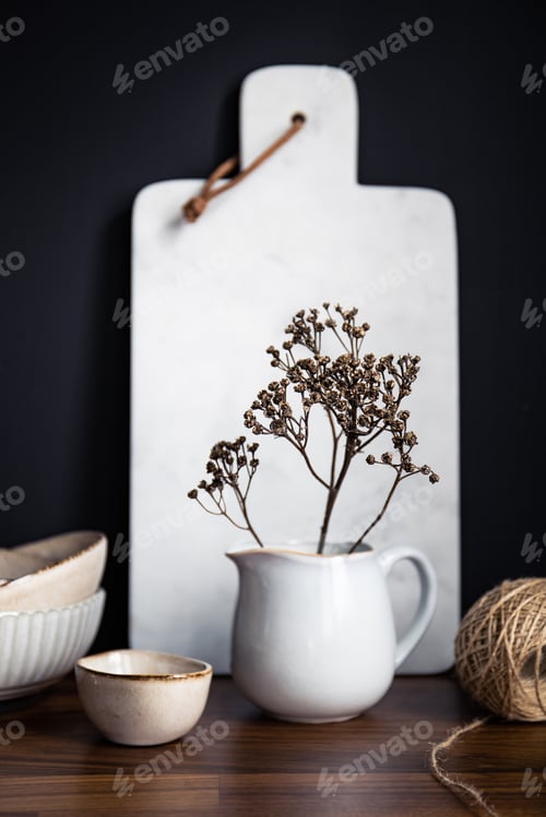 Preview: Set of kitchen ceramic tableware and white marble cutting board on a wooden table.
