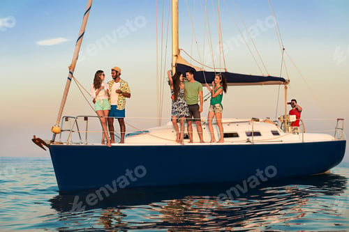 Preview: Young people standing on yacht.