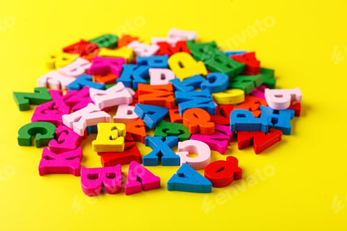 Preview: colored letters of the alphabet on a yellow background