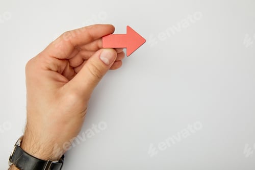Preview: cropped view of man holding red pointer on grey background