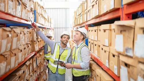 Preview: A worker in the warehouse checking the stock is on the shelves at the manufacturing.