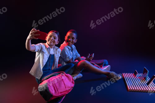 Preview: Photographing. Delighted Adorable Boy And A Girl Smiling And Taking Selfies While Sitting On The