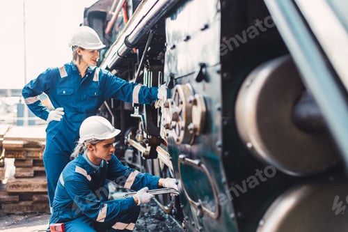 Preview: Train engineer team working service maintenance old dirty vintage classic steam engine locomotive in