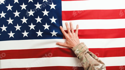 Preview: Soldier hand on The American Flag