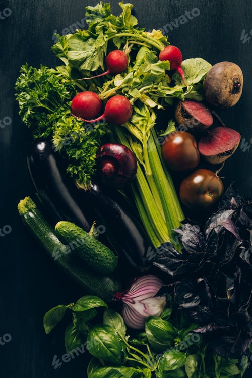 Preview: top view of radishes, eggplants and beetroots on grey dark table