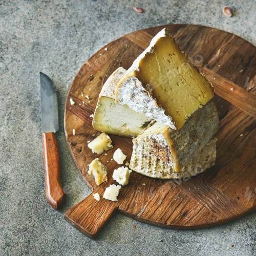 Preview: Cheese assortment on board, close-up, vertical composition