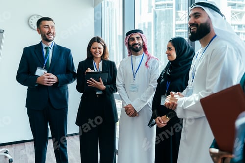 Preview: Multiethnic business team participating in corporate meeting in dubai office