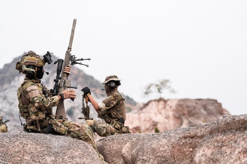 Preview: Soldiers in Combat Gear Holding Tactical Positions on Rocky Terrain