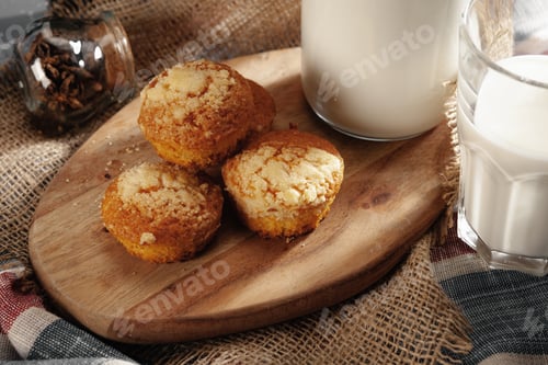 Preview: Glass of milk and cookies on table