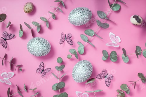 Preview: Pattern of Easter eggs, eucalyptus, butterflies and beads. Trendy flat lay composition on color background