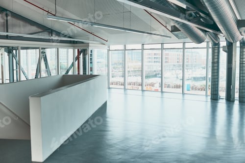 Preview: Shot of an empty office covered with widows and with a staircase leading to a bottom area