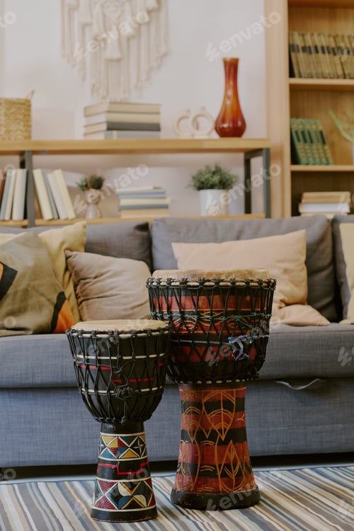 Preview: Traditional Drums Standing on Rug Celebrating Kwanzaa Indoors