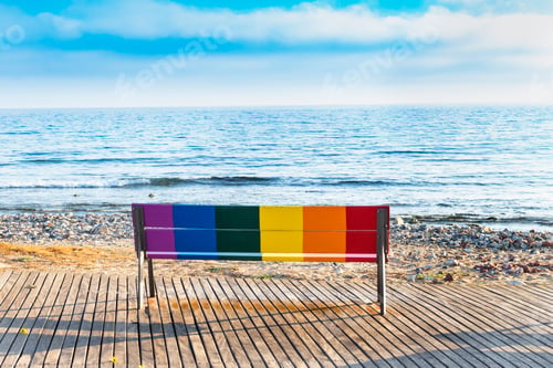 Preview: Seat in front of the beach painted with the colors of the LGBT flag.