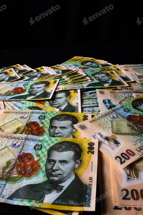 Preview: Vertical closeup of the Romanian LEI bill pile spread on a black background