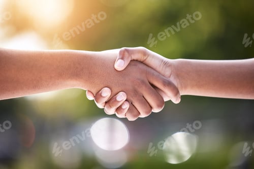 Preview: Theres always new people to meet. Shot of two unrecognizable people shaking hands outside.