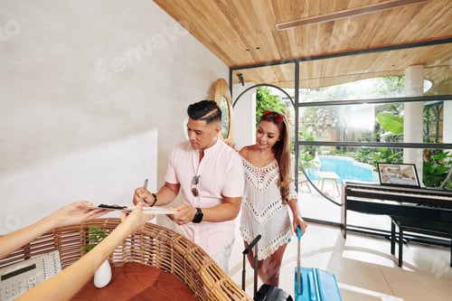 Preview: Couple at hotel reception