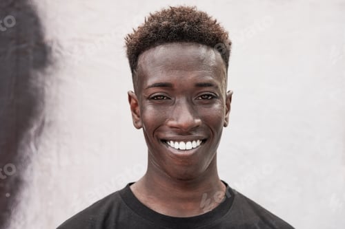 Preview: Portrait of young african man smiling on camera