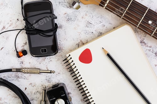 Preview: Music stuff. Guitar, guitar pedal, headphone, mobile phone on white background. Top view. Flat lay