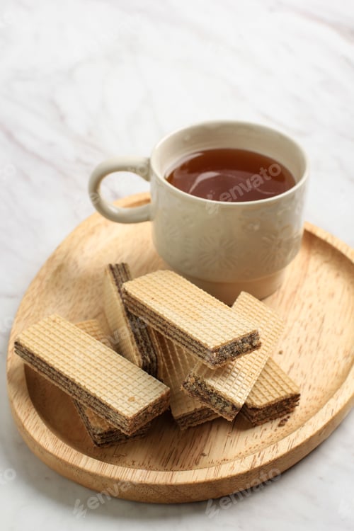 Preview: Chocolate Wafer on Wooden Plate, Served with Tea