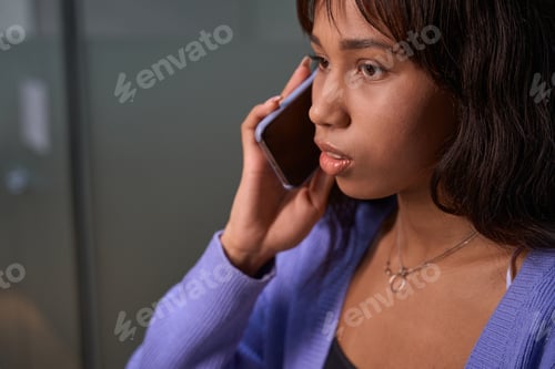 Preview: Attractive woman having dialogue by mobile phone in room