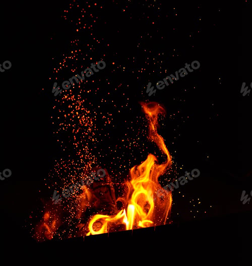 Preview: Large burning bonfire with flame and orange sparks that fly in different directions