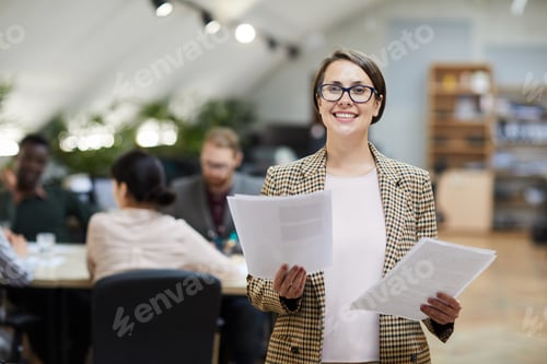 Preview: Smiling Businesswoman Posing in Office