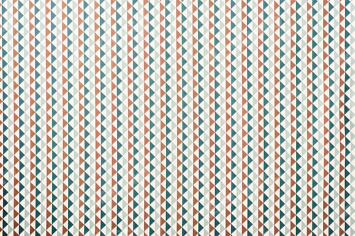Preview: full frame of white fabric with green and brown triangles ornament background
