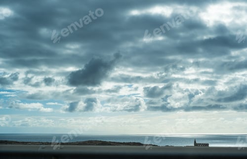 Preview: Dark cloudy blue sky and horizon over the water in Tenerife island, Atlantic ocean.