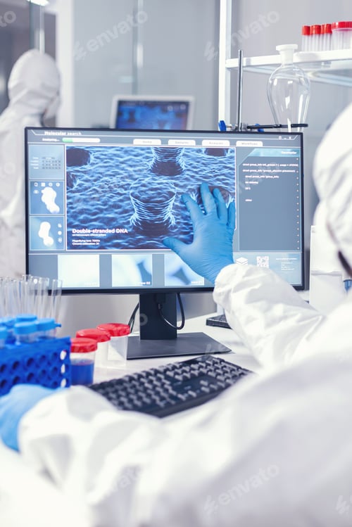 Preview: Chemist man looking computer screen working on vaccine