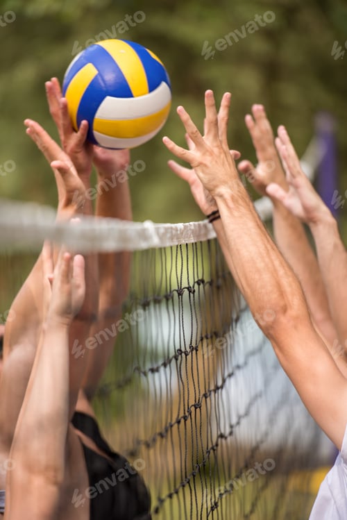 Preview: group of young friends playing Beach volleyball