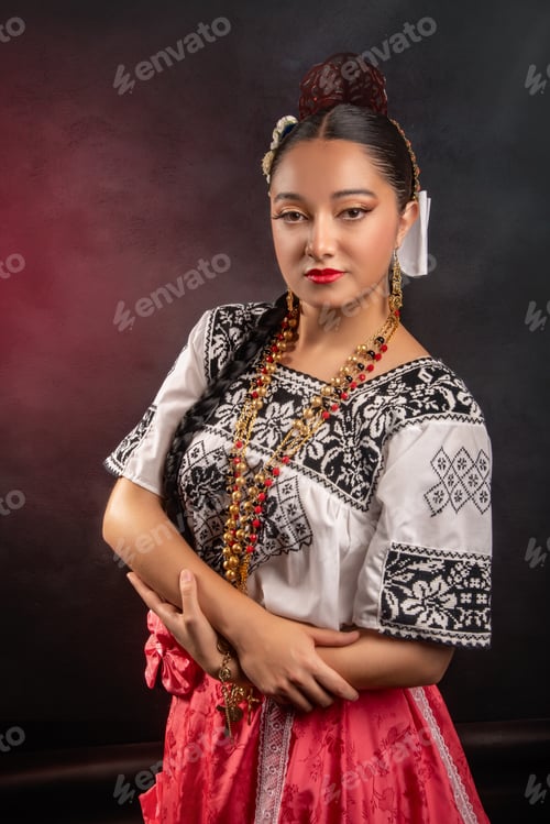 Preview: A woman wearing a traditional Mexican dress and a flowery headband