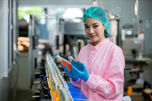 Preview: Worker Checking quality or checking stock of glass bottle in beverage factory.