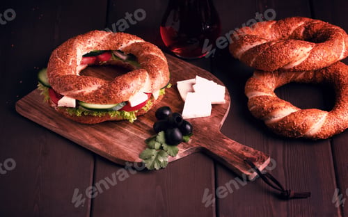 Preview: Traditional Turkish bagel simit, breakfast, on a wooden table, rustic, horizontal, no people,