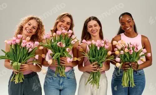 Preview: Diverse women holding bouquets of pink tulips