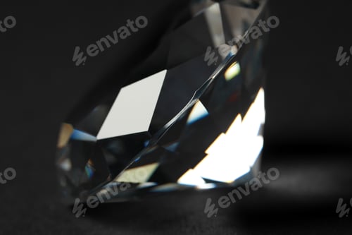 Preview: Beautiful dazzling diamond on dark background, closeup. Precious gemstone