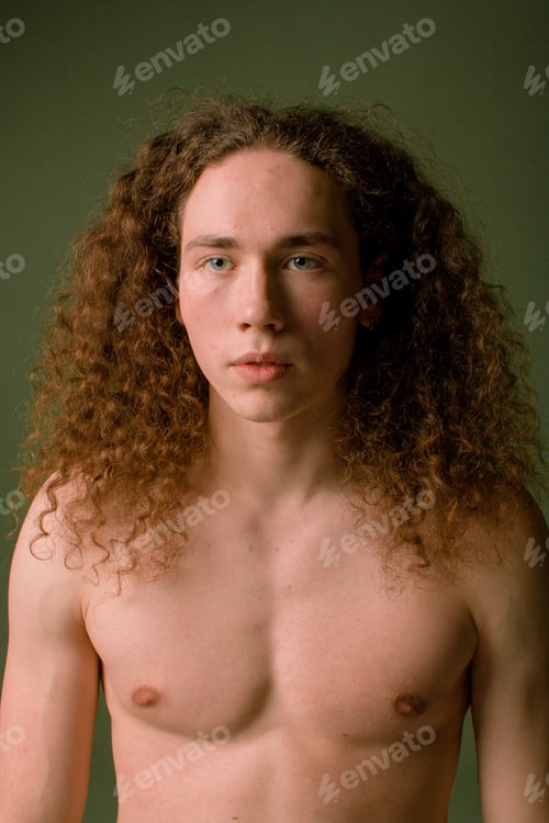 Preview: Attractive And Stylish Guy With Curly Hair And A Sports Figure