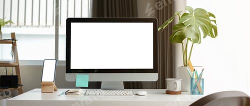Preview: Mock up computer and smart phone with blank screen on white table.