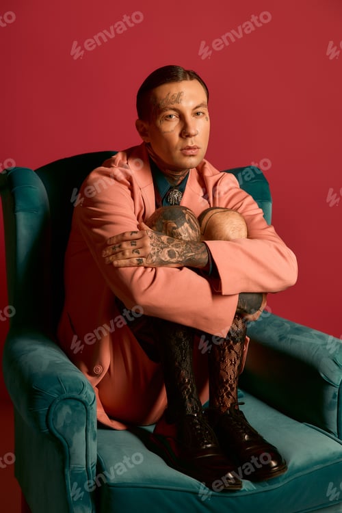 Preview: Stylish man embraces comfort in a vibrant setting while showcasing modern fashion trends