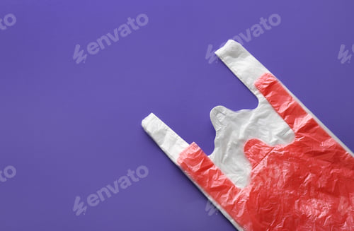 Preview: Clear disposable plastic bags on color background. Space for text
