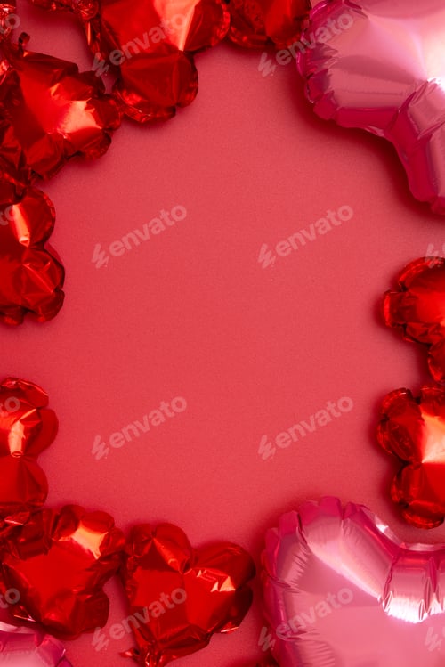Preview: Valentines Day festive background from red foil balloons in the shape of heart