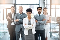 Preview: Portrait of a focused group of colleagues standing together in a modern office