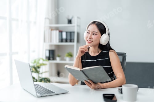 Preview: Woman Working from Home with Laptop and Headphones