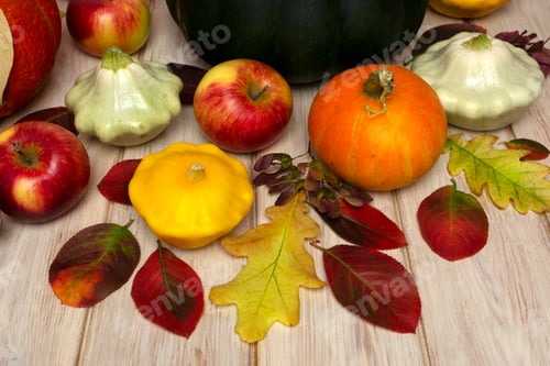 Preview: Pumpkins, Apples, and Autumn Leaves on Wood Surface