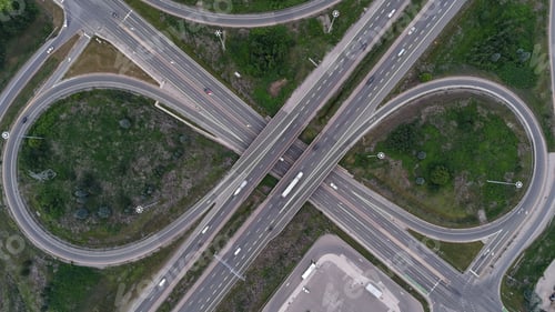 Preview: Aerial view of a highway interchange with looping roads and green spaces in Cambridge, Canada