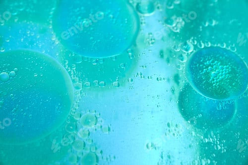 Preview: abstract turquoise green and blue background formed by oil drops on water