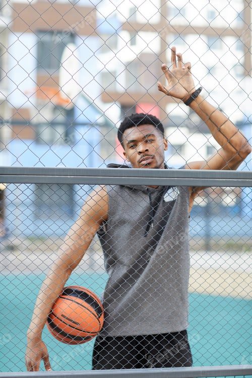 Preview: Handsome African-American Man in Basketball Court