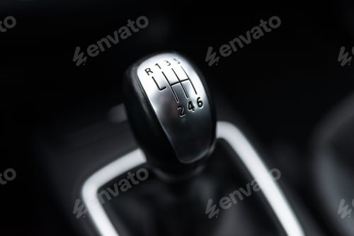 Preview: Black interior of a modern car, six-speed manual shift car gear lever.