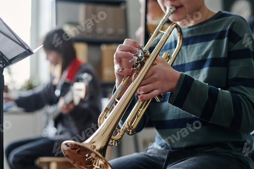Vista previa: Unrecognizable Boy Playing Trumpet
