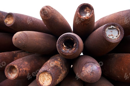 Preview: Closeup shot of a pile of old unexploded bombs.