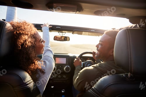 Preview: Couple drive looking at each other, rear passenger POV